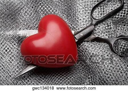 Close-up of a heart and a pair of scissors on fabric View Large Photo Image Stock Photo - Close-up of a heart and a pair of scissors on fabric. Fotosearch