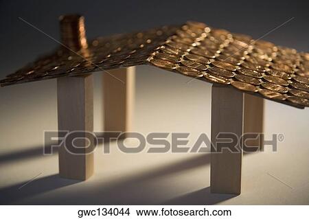Close-up of a model of a house made with coins View Large Photo Image Picture - Close-up of a model of a house made with coins. Fotosearch