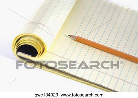 Close-up of a pencil on a notepad View Large Photo Image Stock Photo - Close-up of a pencil on a notepad. Fotosearch
