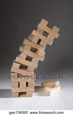 Close-up of a stack of falling wooden blocks View Large Photo Image Stock Image - Close-up of a stack of falling wooden blocks. Fotosearch