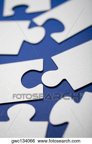 Close-up of jigsaw pieces View Large Photo Image Stock Photograph - Close-up of jigsaw pieces. Fotosearch