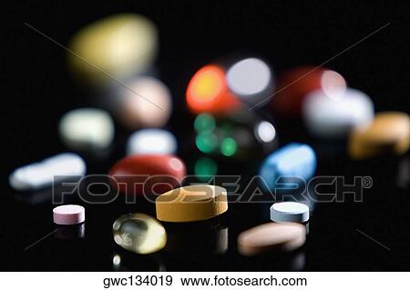 Close-up of pills and capsules View Large Photo Image Stock Photo - Close-up of pills and capsules. Fotosearch