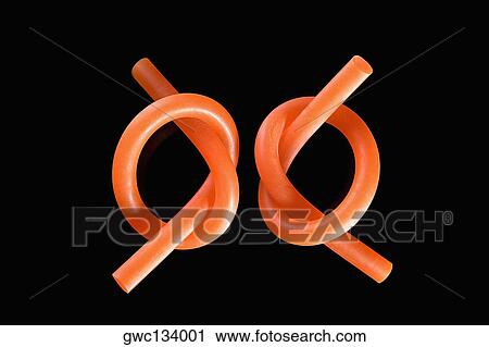 Stock Image - Close-up of two knotted pipes. Fotosearch