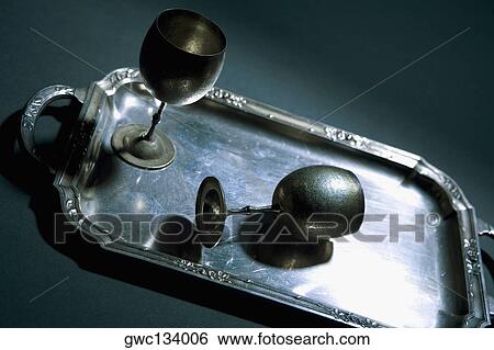 Stock Photograph - Close-up of two wine goblets on a tray. Fotosearch