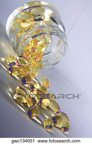 Close-up of vitamin e capsules spilling from a jar View Large Photo Image Stock Image - Close-up of vitamin e capsules spilling from a jar. Fotosearch