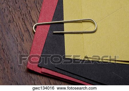 High angle view of a paper clip on files View Large Photo Image Stock Photograph - High angle view of a paper clip on files. Fotosearch