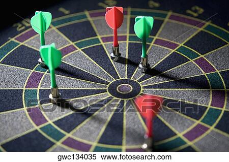 Stock Photography - High angle view of darts on a dartboard. Fotosearch