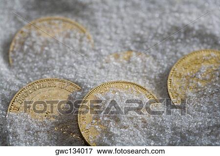 High angle view of five coins in salt View Large Photo Image Stock Photo - High angle view of five coins in salt. Fotosearch