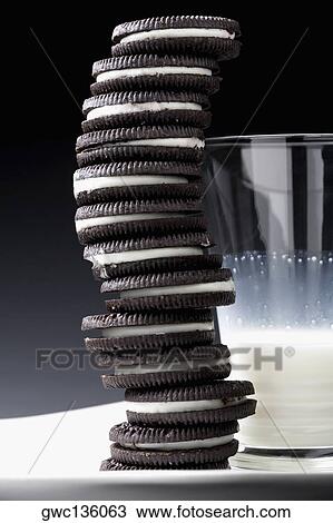 Close-up of a glass of milk with stack of cookies View Large Photo Image Stock Image - Close-up of a glass of milk with stack of cookies. Fotosearch