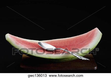Close-up of a spoon on water melon View Large Photo Image Stock Image - Close-up of a spoon on water melon. Fotosearch