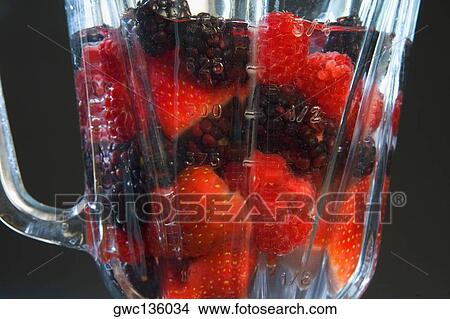 Picture - Close-up of berries in a jug. Fotosearch