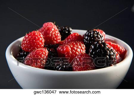 Close-up of raspberries and blackberries in a bowl View Large Photo Image Stock Photo - Close-up of raspberries and blackberries in a bowl. Fotosearch