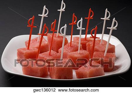 Close-up of the pieces of watermelon on a tray View Large Photo Image Stock Image - Close-up of the pieces of watermelon on a tray. Fotosearch