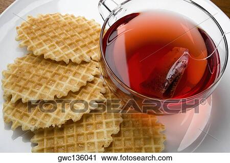 Close-up of waffle with a cup of tea View Large Photo Image Stock Image - Close-up of waffle with a cup of tea. Fotosearch