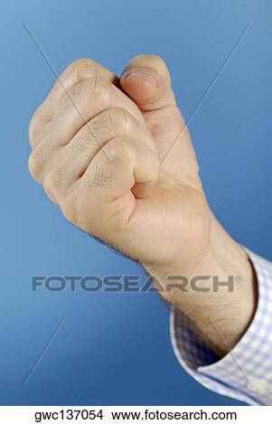 Picture - Close-up of a man's hand making a fist. Fotosearch