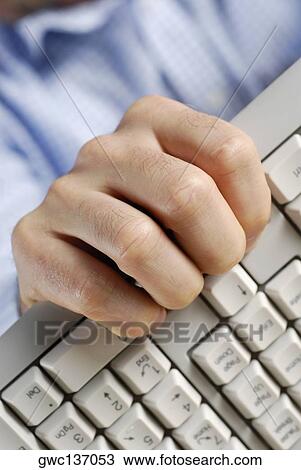 Close-up of a person's hand holding a computer keyboard View Large Photo Image Stock Image - Close-up of a person's hand holding a computer keyboard. Fotosearch