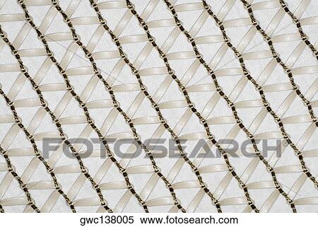 Close-up of a sheet decorated with thread and ribbon View Large Photo Image Stock Photography - Close-up of a sheet decorated with thread and ribbon. Fotosearch