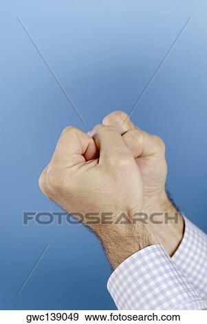 Close-up of a man's hands making fists View Large Photo Image Stock Photo - Close-up of a man's hands making fists. Fotosearch