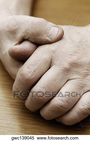 Stock Photography - Close-up of a person's hands. Fotosearch