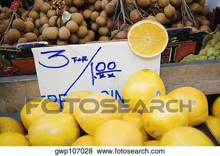 Close-up of oranges and plums at a market stall View Large Photo Image Stock Photo - Close-up of oranges and plums at a market stall. Fotosearch