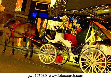 Horsedrawn carriage in front of a building, New York City, New York State, USA View Large Photo Image Stock Photo - Horsedrawn carriage in front of a building, New York City, New York State, USA. Fotosearch