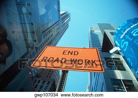 Low angle view of a sign board in front of skyscrapers, New York City, New York State, USA View Large Photo Image Picture - Low angle view of a sign board in front of skyscrapers, New York City, New York State, USA. Fotosearch