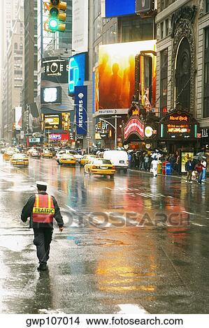 Rear view of a traffic cop walking on the road View Large Photo Image Picture - Rear view of a traffic cop walking on the road. Fotosearch