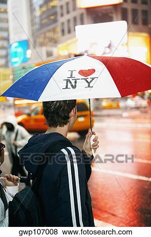 Stock Photo - Side profile of a man standing at the roadside. Fotosearch