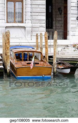 Boats docked at the waterfront, Venice, Veneto, Italy View Large Photo Image Stock Photography - Boats docked at the waterfront, Venice, Veneto, Italy. Fotosearch