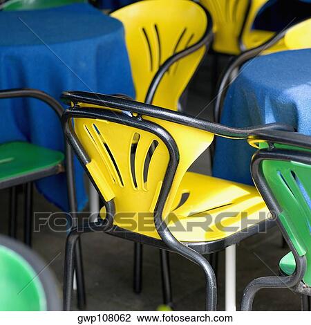 Chairs and tables at a sidewalk cafe, Venice, Veneto, Italy View Large Photo Image Stock Image - Chairs and tables at a sidewalk cafe, Venice, Veneto, Italy. Fotosearch