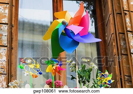 Close-up of a pinwheel in front of a window View Large Photo Image Stock Image - Close-up of a pinwheel in front of a window. Fotosearch