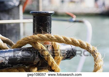 Close-up of a rope tied to a pole View Large Photo Image Stock Photo - Close-up of a rope tied to a pole. Fotosearch