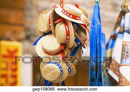 Close-up of hats hanging at a market stall View Large Photo Image Stock Photograph - Close-up of hats hanging at a market stall. Fotosearch