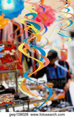 Close-up of multi-colored streamers hanging View Large Photo Image Stock Photo - Close-up of multi-colored streamers hanging. Fotosearch