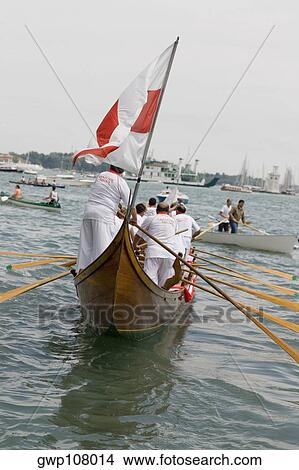 Group of people rowing a gondola, Venice, Veneto, Italy View Large Photo Image Picture - Group of people rowing a gondola, Venice, Veneto, Italy. Fotosearch
