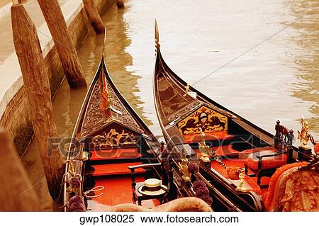 High angle view of two gondolas moored in a canal, Venice, Veneto, Italy View Large Photo Image Stock Photography - High angle view of two gondolas moored in a canal, Venice, Veneto, Italy. Fotosearch