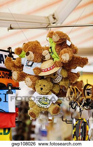 Low angle view of teddy bears hanging in a store View Large Photo Image Stock Photograph - Low angle view of teddy bears hanging in a store. Fotosearch