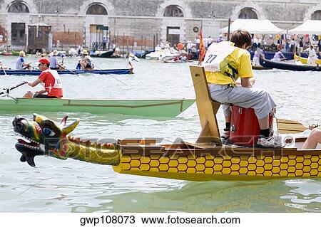 Rear view of a man sitting in a gondola, Venice, Veneto, Italy View Large Photo Image Stock Image - Rear view of a man sitting in a gondola, Venice, Veneto, Italy. Fotosearch