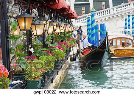 Side profile of a man standing on a gondola, Venice, Veneto, Italy View Large Photo Image Stock Image - Side profile of a man standing on a gondola, Venice, Veneto, Italy. Fotosearch