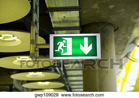 Close-up of an emergency exit sign at an airport, Madrid, Spain View Large Photo Image Stock Photo - Close-up of an emergency exit sign at an airport, Madrid, Spain. Fotosearch