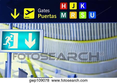Close-up of an emergency exit sign at an airport, Madrid, Spain View Large Photo Image Stock Photo - Close-up of an emergency exit sign at an airport, Madrid, Spain. Fotosearch