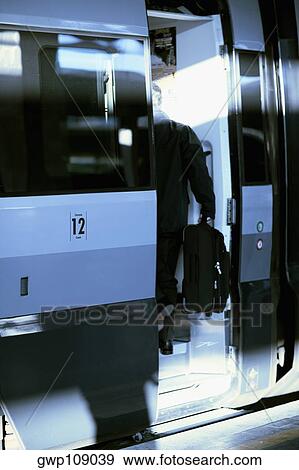 Man entering in a train, Rome, Italy View Large Photo Image Stock Photo - Man entering in a train, Rome, Italy. Fotosearch