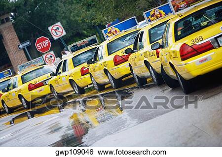 Taxi cabs waiting in a row, Savannah, Georgia, USA View Large Photo Image Stock Photograph - Taxi cabs waiting in a row, Savannah, Georgia, USA. Fotosearch