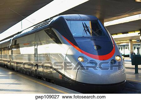 Train at a railroad station platform, Rome, Italy View Large Photo Image Stock Photo - Train at a railroad station platform, Rome, Italy. Fotosearch