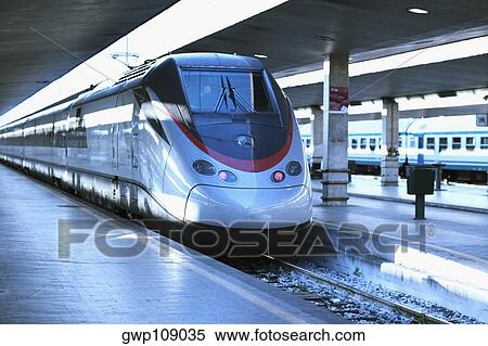 Train at a railroad station platform, Rome, Italy View Large Photo Image Stock Photography - Train at a railroad station platform, Rome, Italy. Fotosearch