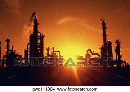 Chemical refinery plant and smokestacks in silhouette View Large Photo Image Picture - Chemical refinery plant and smokestacks in silhouette. Fotosearch