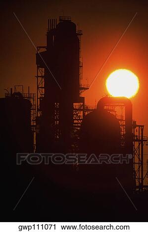 Chemical refinery plant and smokestacks in silhouette View Large Photo Image Stock Image - Chemical refinery plant and smokestacks in silhouette. Fotosearch