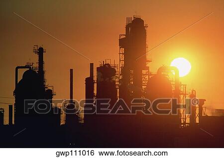 Chemical refinery plant and smokestacks in silhouette View Large Photo Image Stock Photograph - Chemical refinery plant and smokestacks in silhouette. Fotosearch