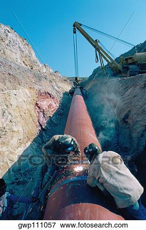 Laying large pipes in Jordan View Large Photo Image Stock Photo - Laying large pipes in Jordan. Fotosearch