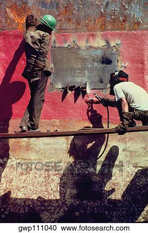 Men welding a ship View Large Photo Image Stock Image - Men welding a ship. Fotosearch